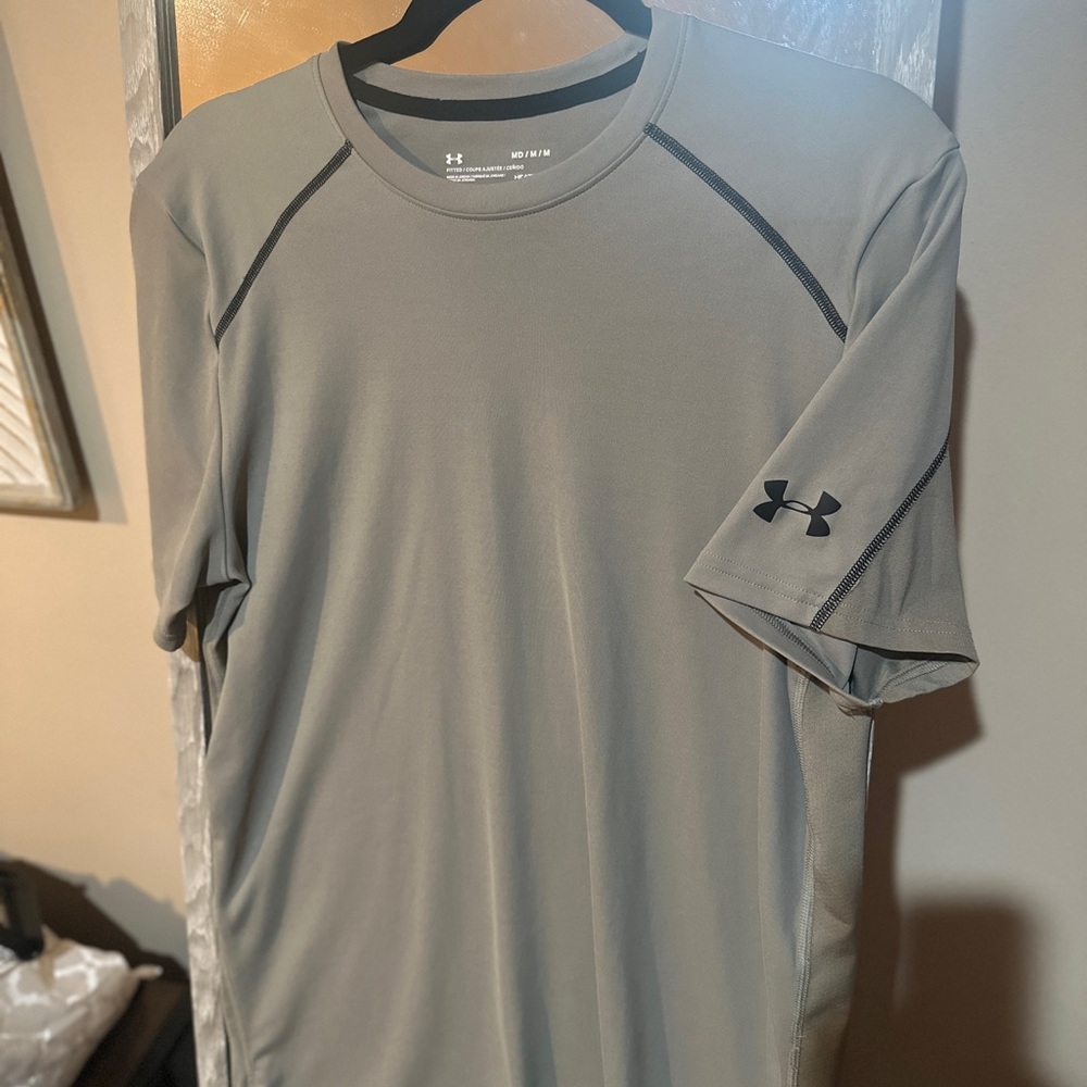 Under Amour workout shirt, form fitting yet breathable and keeps you cool.